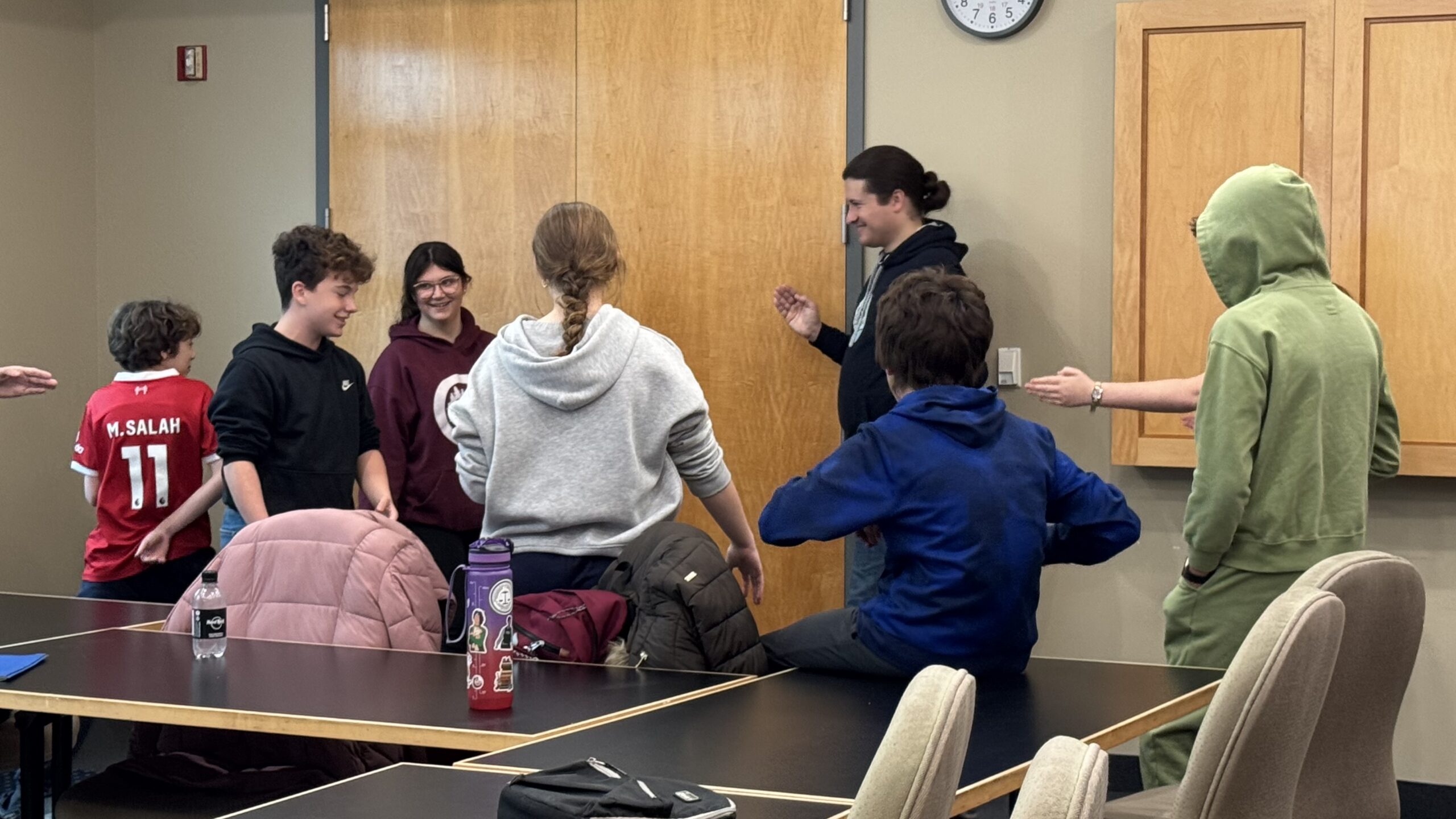 TeenShemet students playing a group game during a break