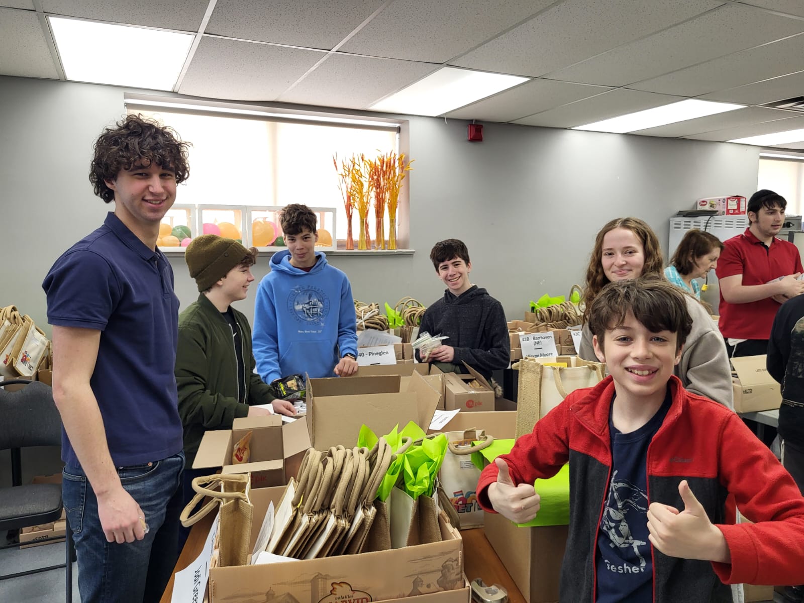 TeenShemet students preparing community-service packages together